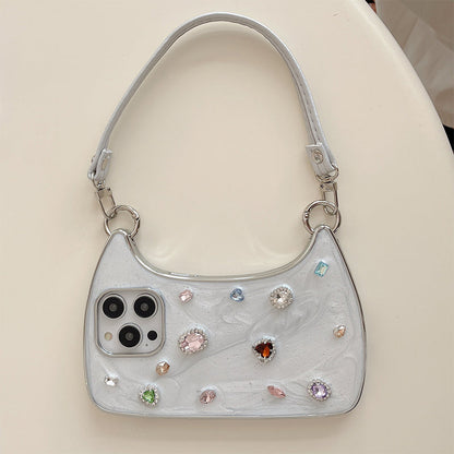 🥳2026 HOT SALE🥳💞50K+ SOLD!💥✨💎 50% OFF! Creative Phone Case with Top Handle – Synthetic gemstones add luxury shine. Easy carry handle, precise cutouts. Durable TPU protection. Transform your phone into a chic accessory. 📱👜
